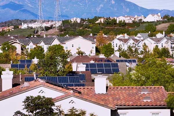 Rooftop view of houses with solar panels