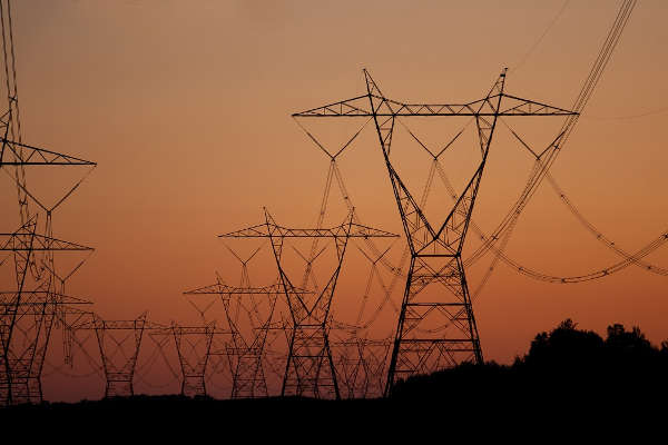 Electric power lines over sunrise