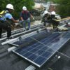 Solar panel installers at work
