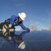 Woman-installing-solar-panels