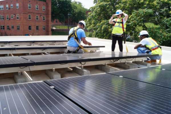 Women-installing-rooftop-solar-for-GridAlternatives