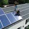 Approved-solar-installers-work-on-the-roof-of-a-house