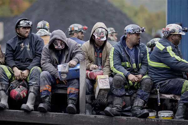 Coal-miners-return-on-a-buggy-after-working-a-shift