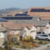 solar-panels-on-rooftops-of-a-housing-development-in-Folsom,-Calif.